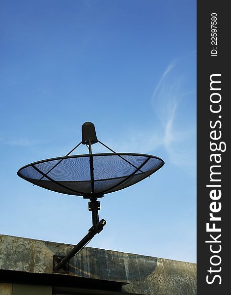 Satellite dish in blue sky