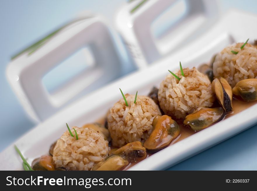 Shells with rice on the blue background