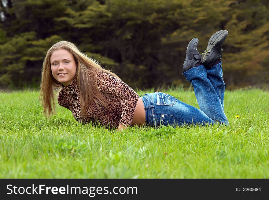 Cheerful girl on the grass