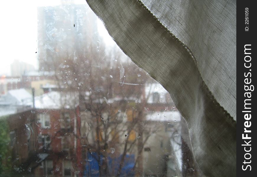 Window, curtains on rainy day