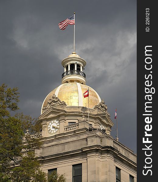 Gold Domed City Hall with waving flag during storm. Gold Domed City Hall with waving flag during storm