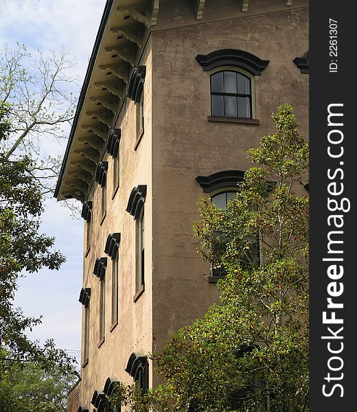 Historic Building side view with trees and windows. Historic Building side view with trees and windows