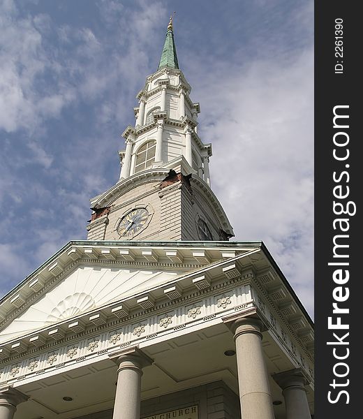 Historic Church steeple with cross against blue sky. Historic Church steeple with cross against blue sky