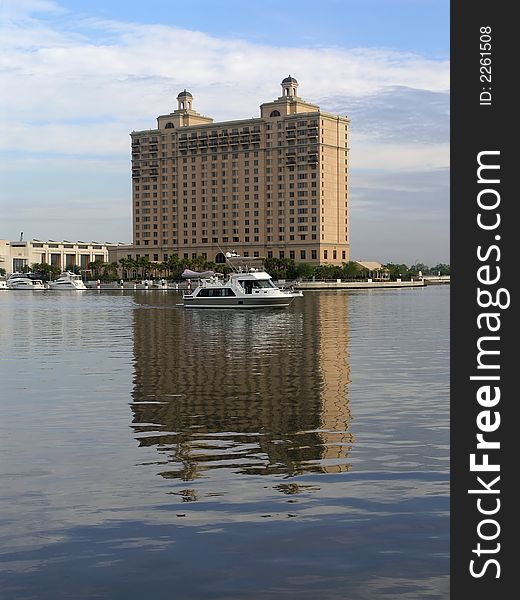 Luxury Hotel reflecting in water with two spires & Yacht. Luxury Hotel reflecting in water with two spires & Yacht