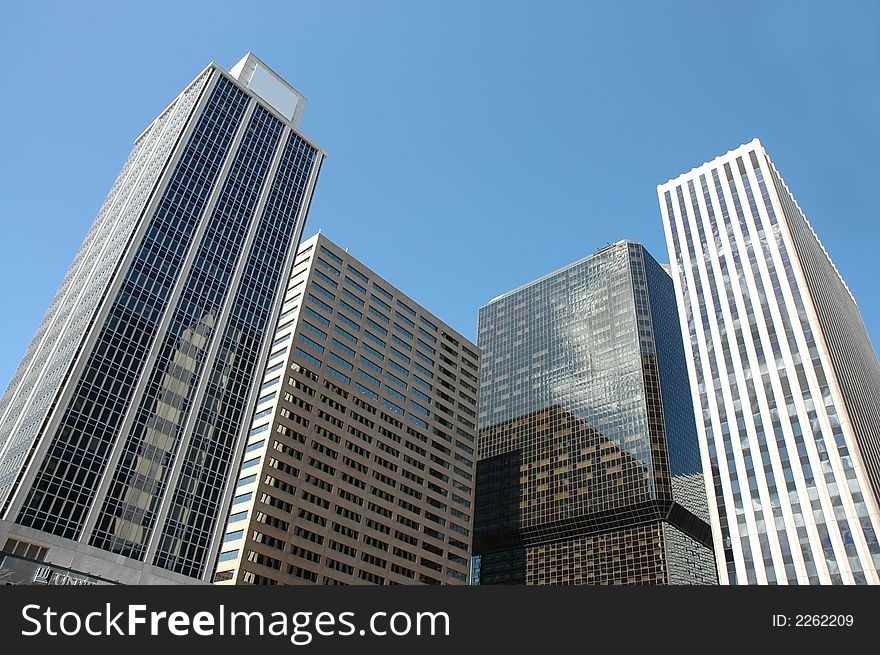 A photo of multiple sky scrapers in downtown denver. A photo of multiple sky scrapers in downtown denver