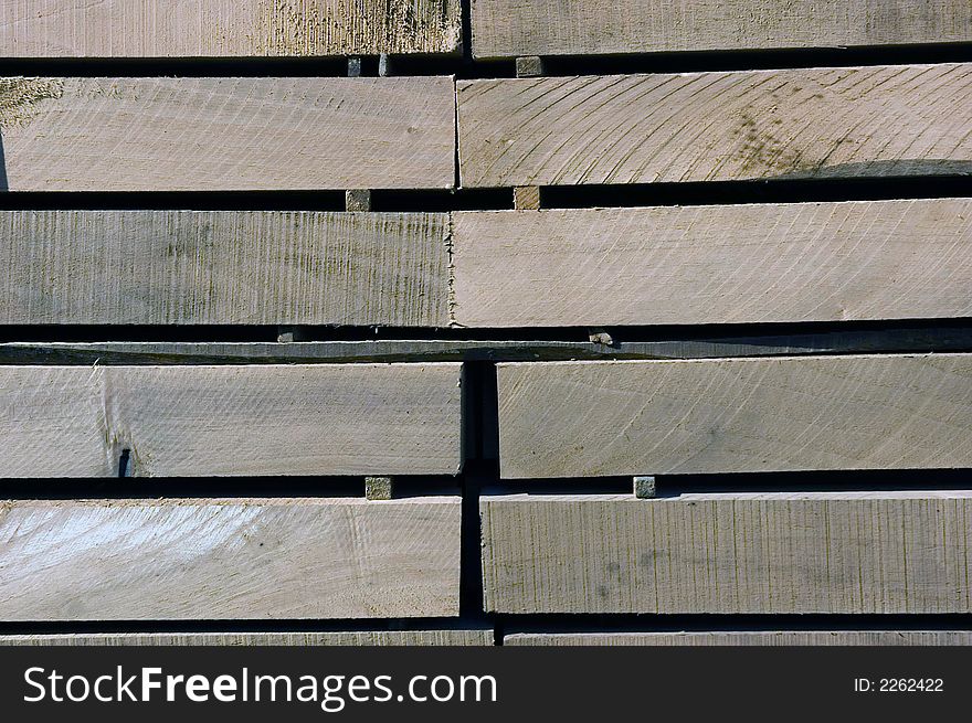 Cut wood elements arranged for transport in a warehouse.