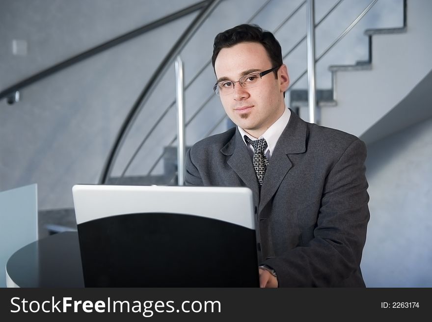 Successful businessman working on laptop