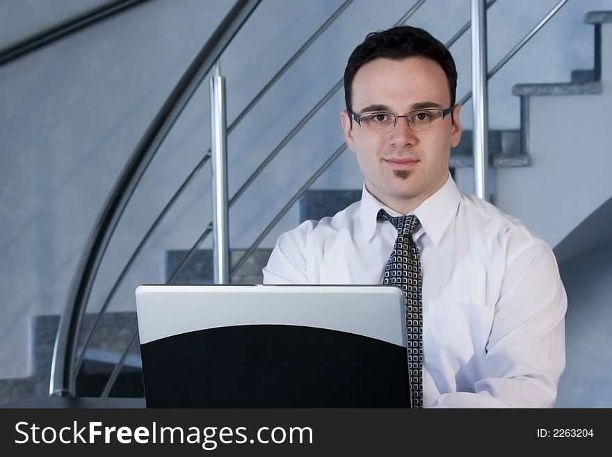 Successful businessman working on laptop