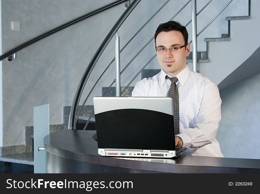 Successful businessman working on laptop