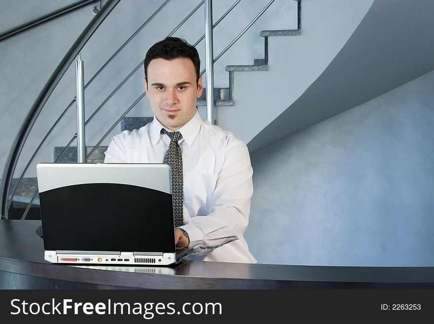 Successful businessman working on laptop
