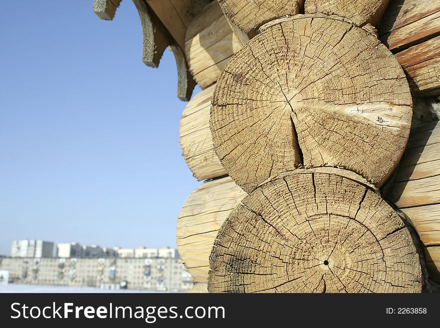 Part of a wooden log hut close up