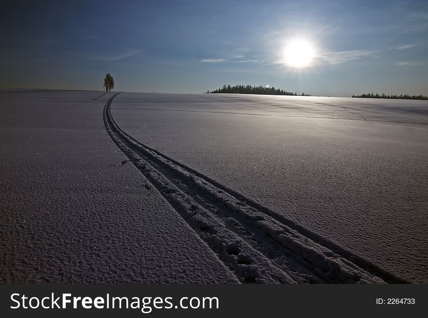 Sun and snow landscape with trail of ski. Sun and snow landscape with trail of ski
