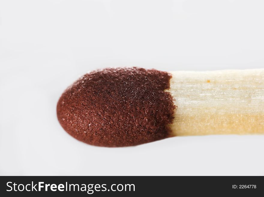 A macro photo of a single matchstick. A macro photo of a single matchstick