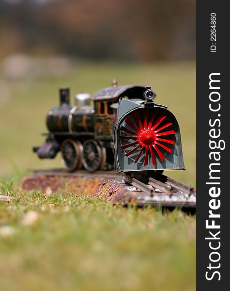 Historic toy train on grass