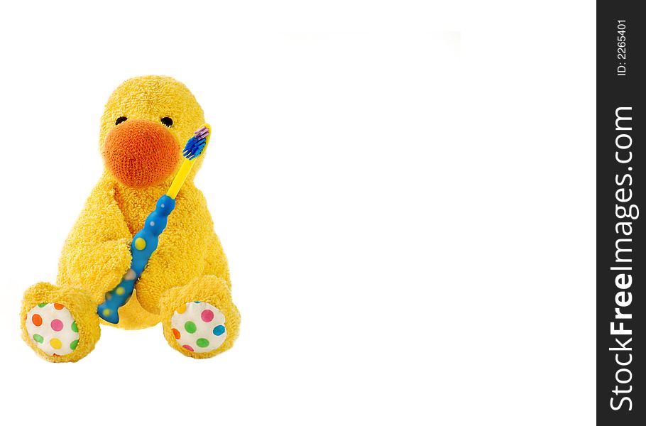 An image of a fabric duck and a child's toothbrush. An image of a fabric duck and a child's toothbrush.