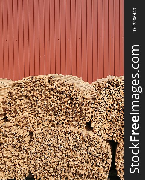 A pile of wooden sticks against blue sky. A pile of wooden sticks against blue sky