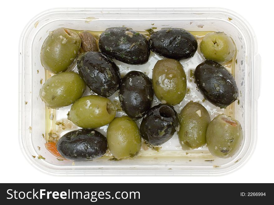 Black and green olives in a plastic bowl. Isolated on a white background. Black and green olives in a plastic bowl. Isolated on a white background.