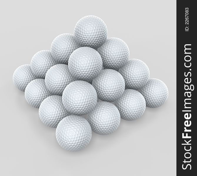 Golf ball pyramid stack on gray background