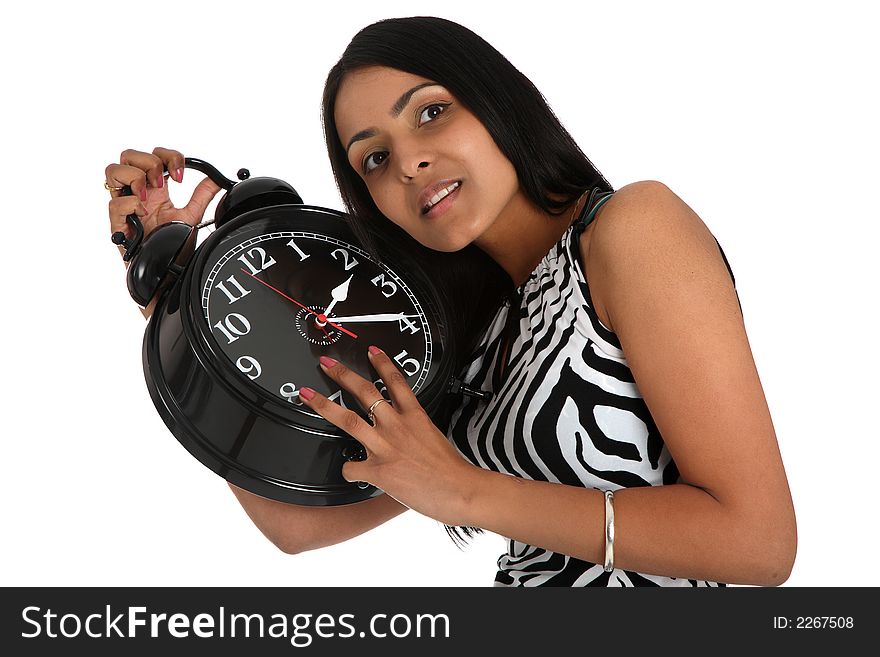 Young asian woman listening to an alarm clock. Young asian woman listening to an alarm clock