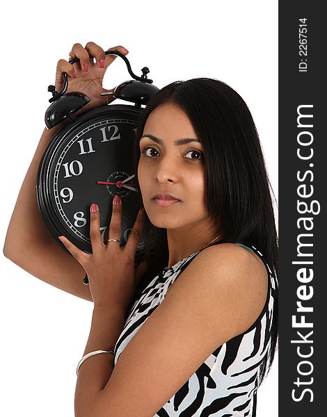 Young asian woman listening to an alarm clock. Young asian woman listening to an alarm clock