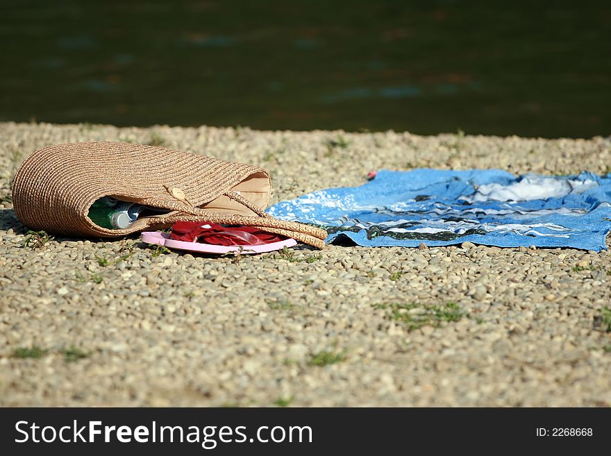 Bag, towel and water bottle on the beach. Bag, towel and water bottle on the beach