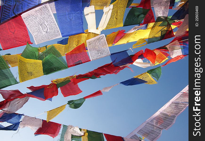 Prayer flags in a with buddhist inscriptions