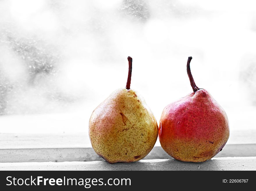 Two pears at the window