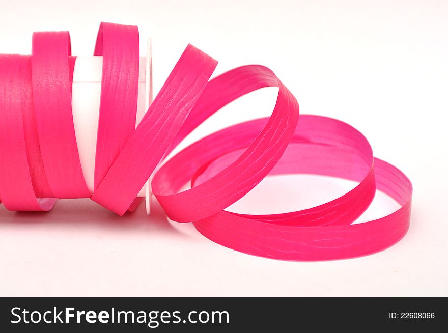 Magenta ribbon forming a spiral on white background. Magenta ribbon forming a spiral on white background