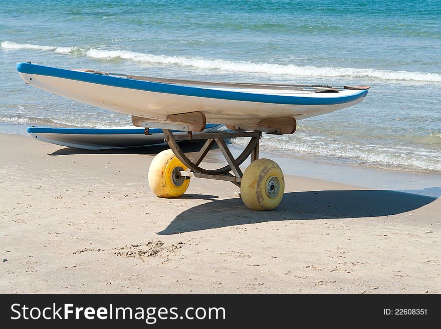 Classical surf boards on a  sandy beach ready for extreme action sport