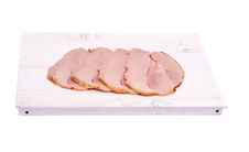 Ham Slices On White Wooden Board, Isolated Stock Photo Ham Slices On White Wooden Board, Isolated Stock Photo