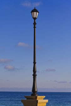 Street Lamp, Sea And Sky Stock Photo