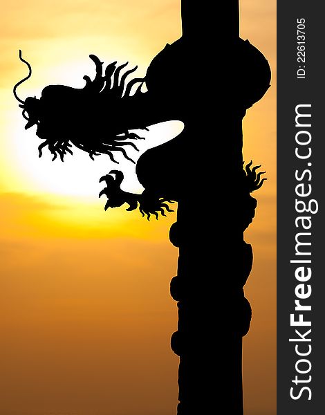 Image of Dragon silhouette with sunset