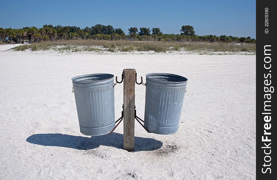 Pair Of Trash Cans On A Beach