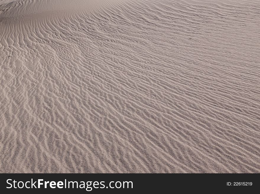 This image captures the intricate patterns of the Mesquite sand dunes in Death Valley National Park. This image captures the intricate patterns of the Mesquite sand dunes in Death Valley National Park.