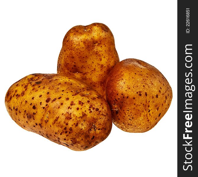Three fresh, raw potatoes isolated over white background. Three fresh, raw potatoes isolated over white background.