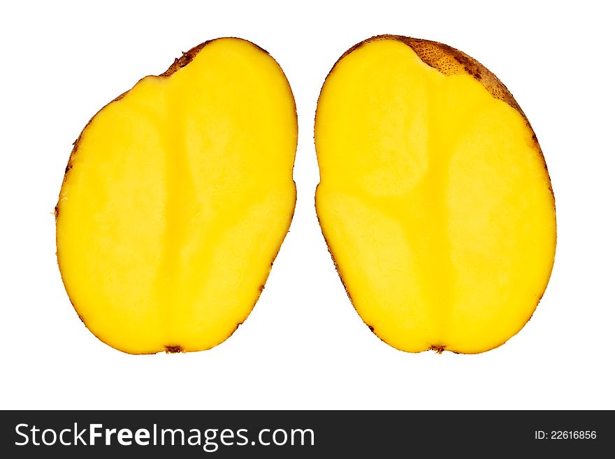 Fresh, raw potato cut in half isolated over white background. Fresh, raw potato cut in half isolated over white background.