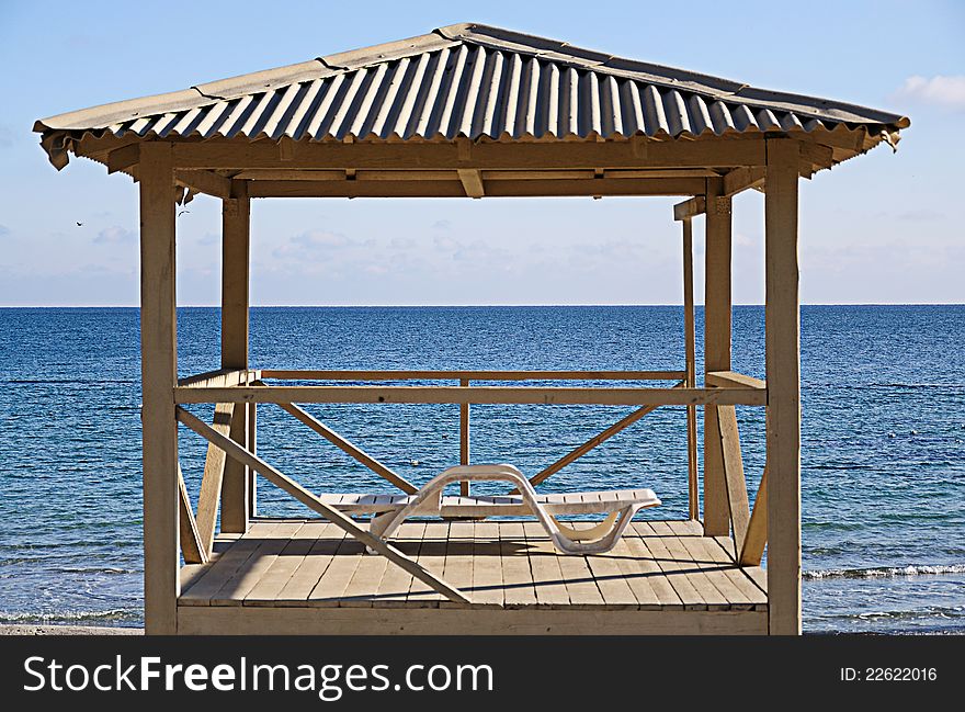 Empty tower of the rescuer in a sunny day on a background of the sea