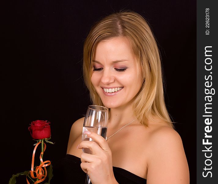 Beautiful woman smelling roses