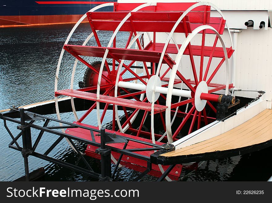 Red paddle wheel on a boat