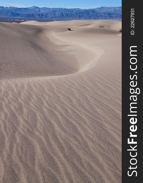 This image captures the interesting patterns of the Mesquite sand dunes in Death Valley National Park. This image captures the interesting patterns of the Mesquite sand dunes in Death Valley National Park.