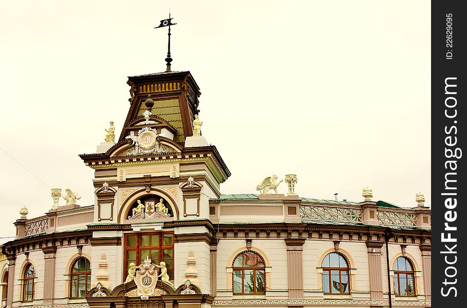 Facade Of The Building With A Sculpture