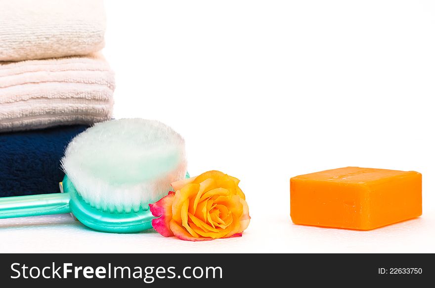 Towels,soap and rose,beauty spa concept,on white background. Towels,soap and rose,beauty spa concept,on white background