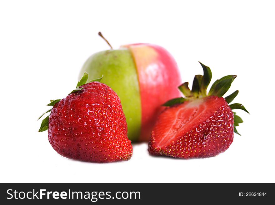 Two strawberries and green apple on isolated white background