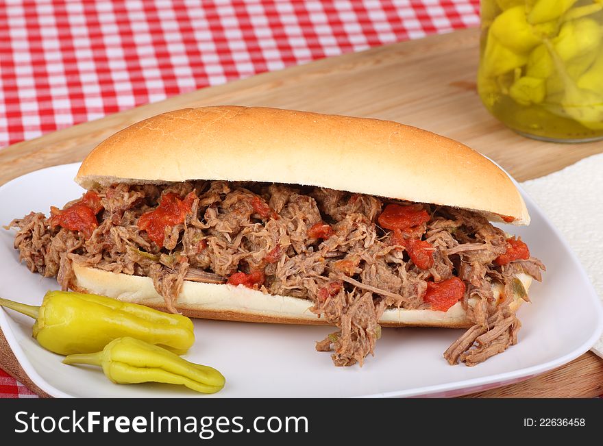 Shredded roast beef sandwich with peperoncini peppers