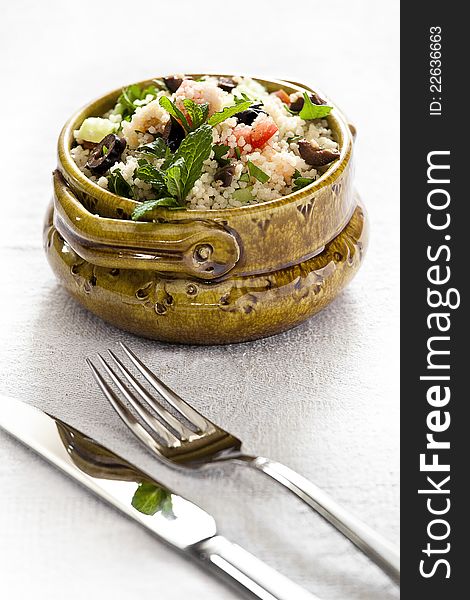 Close up photograph of a couscous salad in a bowl. Close up photograph of a couscous salad in a bowl