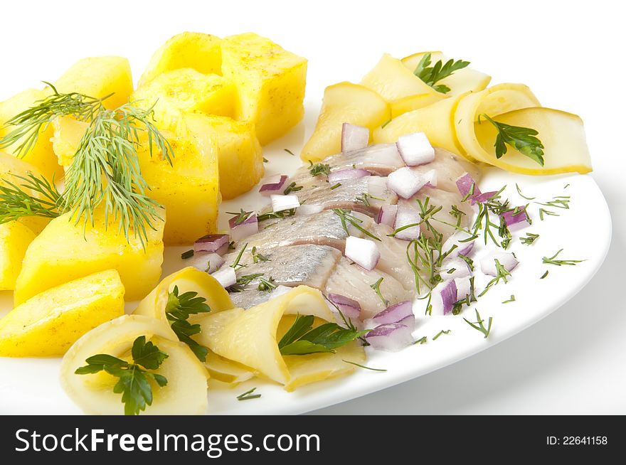 Portion of a herring with a potato and fennel