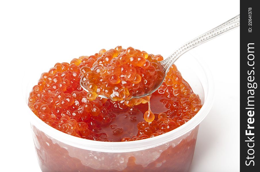 Red caviar in the can on white background. Red caviar in the can on white background