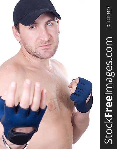 Naked man in gloves in a pose of a boxer. Naked man in gloves in a pose of a boxer