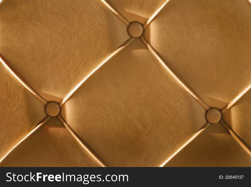 Luxury golden leather close-up background. Luxury golden leather close-up background