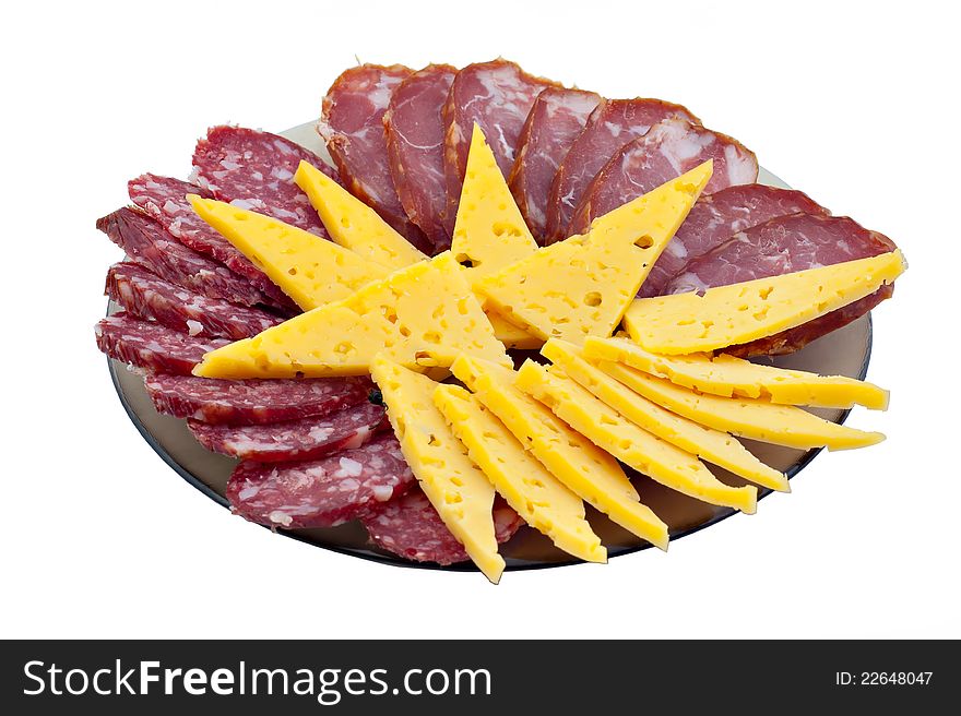 Cutting from a ham, sausage and cheese on a white background